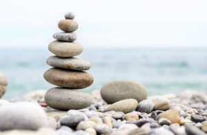 Round Smooth Stones Stacked on Rocky Beach Van Saaze Coaching